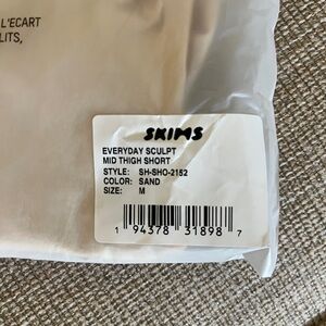 Skims Sand Mid Thigh Shorts